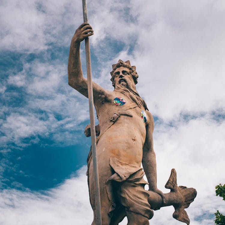 Statue Of Neptune Against Blue Sky