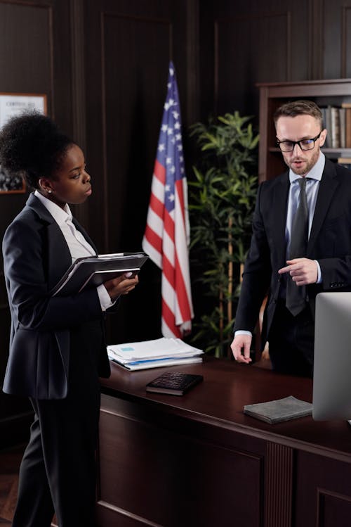 Free Lawyers Talking in an Office Stock Photo
