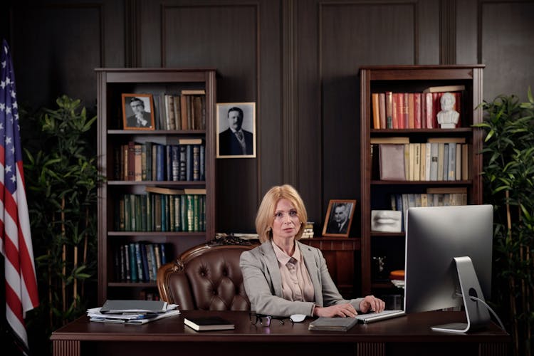 Woman Sitting At Her Office