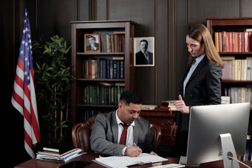 Free Lawyers in an Office Looking at Documents Stock Photo