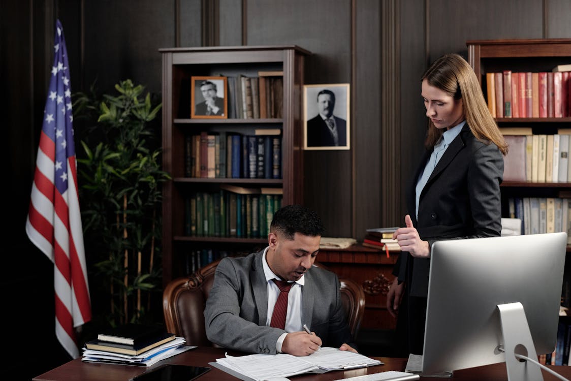 Lawyers In An Office Looking At Documents Free Stock Photo lawyers-in-an-office-looking-at-documents-free-stock-photo