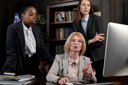 Free Female Lawyers in an Office Looking at a Computer Stock Photo