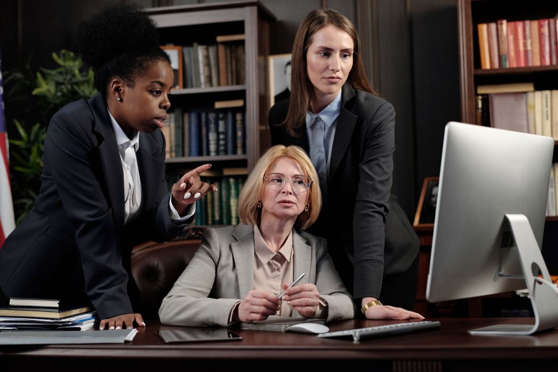 Professional team reviewing information in an office. Stock photograph.