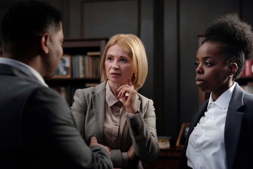 Free Business professionals engaged in a team meeting in an office environment. Stock Photo