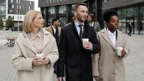 Free Coworkers Walking and Taking a Coffee Break Stock Photo
