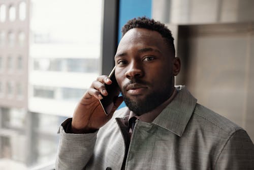 Bearded Man Holding a Cellphone