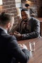 Businessmen Having a Meeting at a Cafe