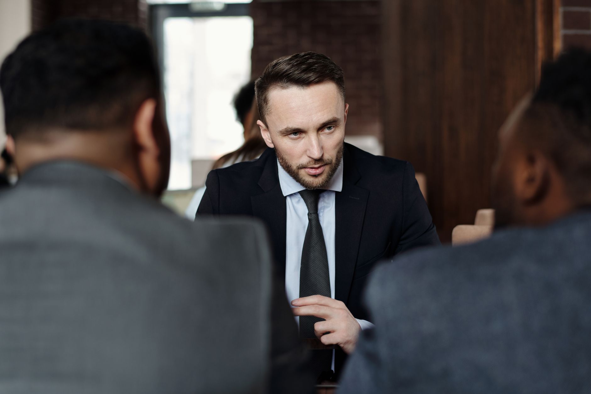 a responsible gambling advisor discussing deposit limits with a player in a quiet consultation room