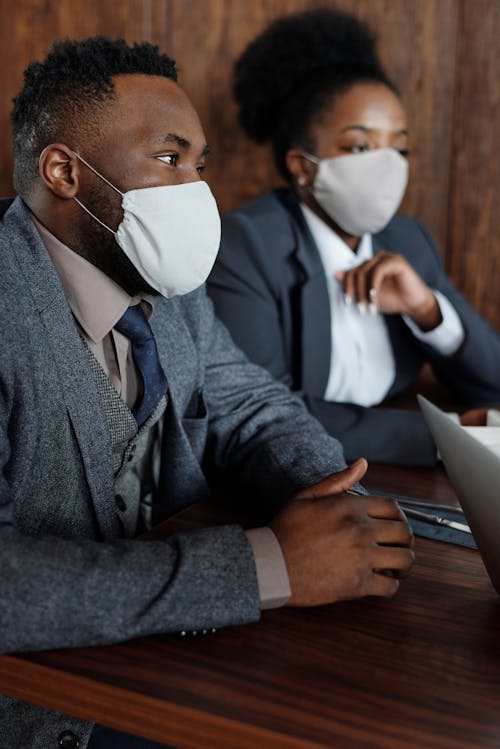 Free People in Business Suits with Face Masks Stock Photo