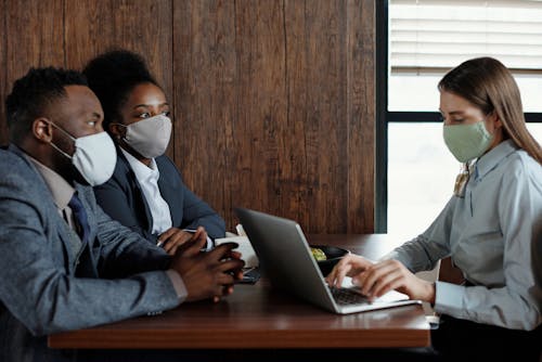 Business People Wearing Face Masks on a Meeting