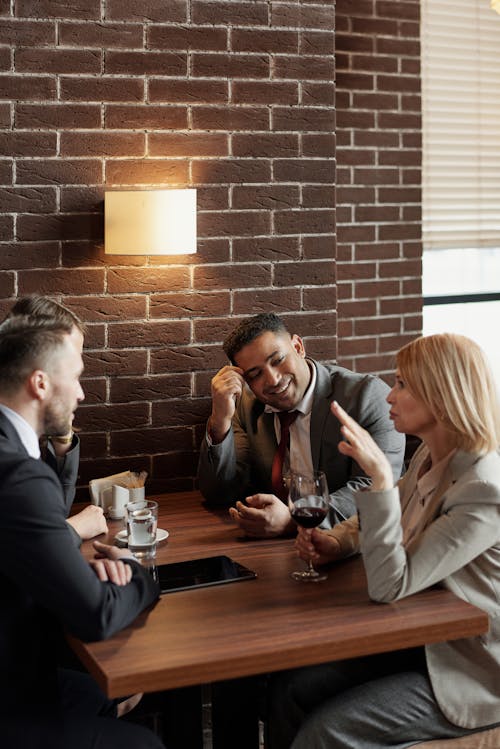 Coworkers Talking at a Cafe