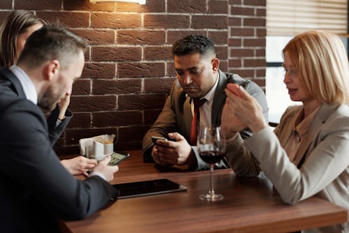 Free Coworkers Sitting at a Café Stock Photo