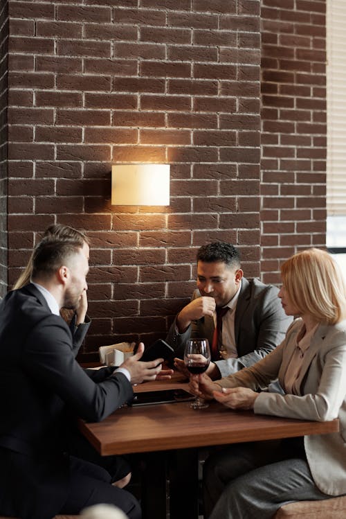 Free Coworkers Sitting at a Café Stock Photo