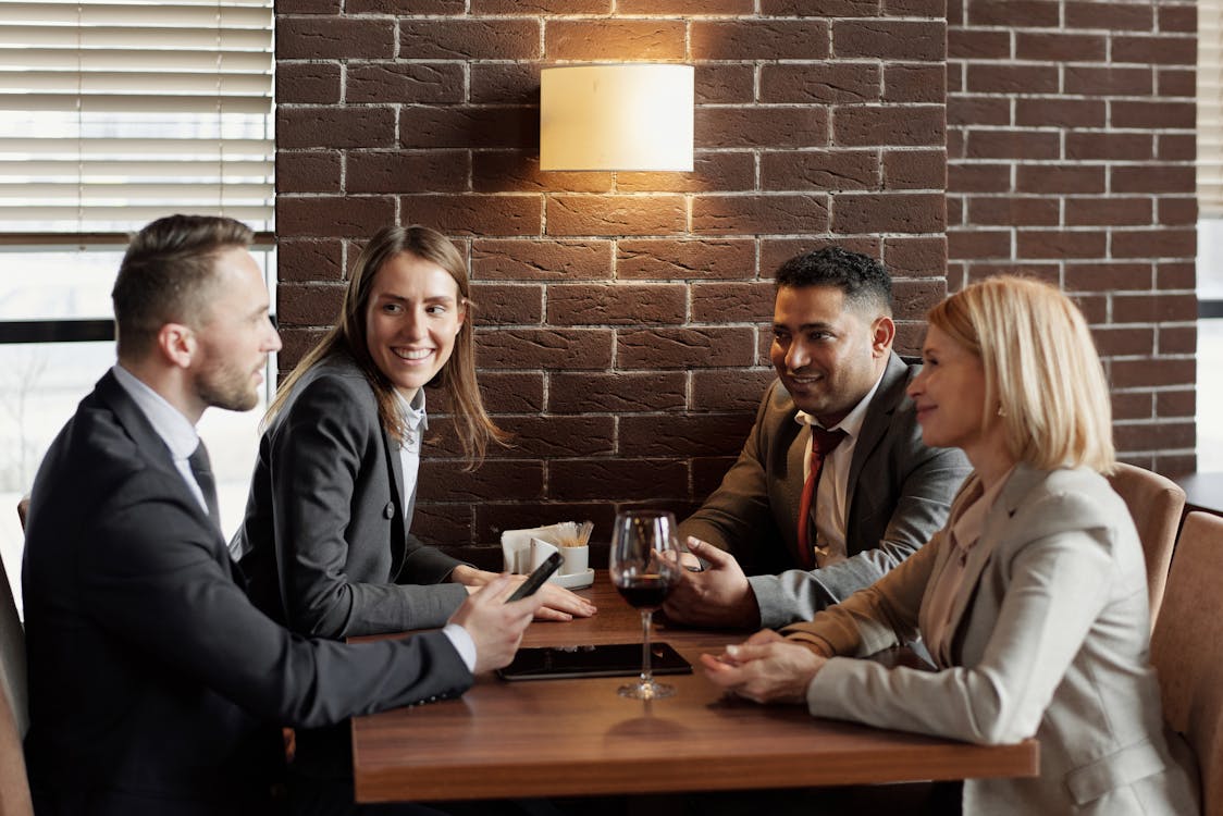 Free Coworkers Talking at a Cafe Stock Photo