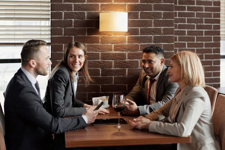 Coworkers Talking At A Cafe