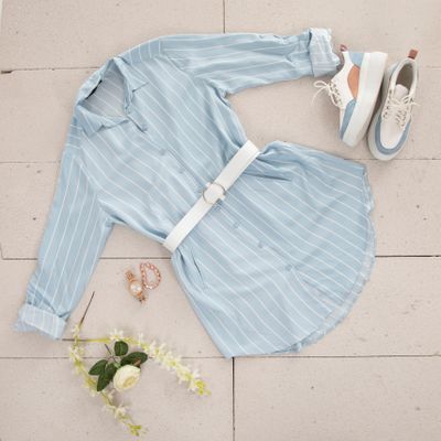 Striped shirt dress laid out with sneakers, photo by Engin Akyurt on Pexels