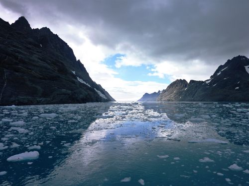 Free Majestic icy seascape with mountains in South Georgia, captivating overcast sky. Stock Photo