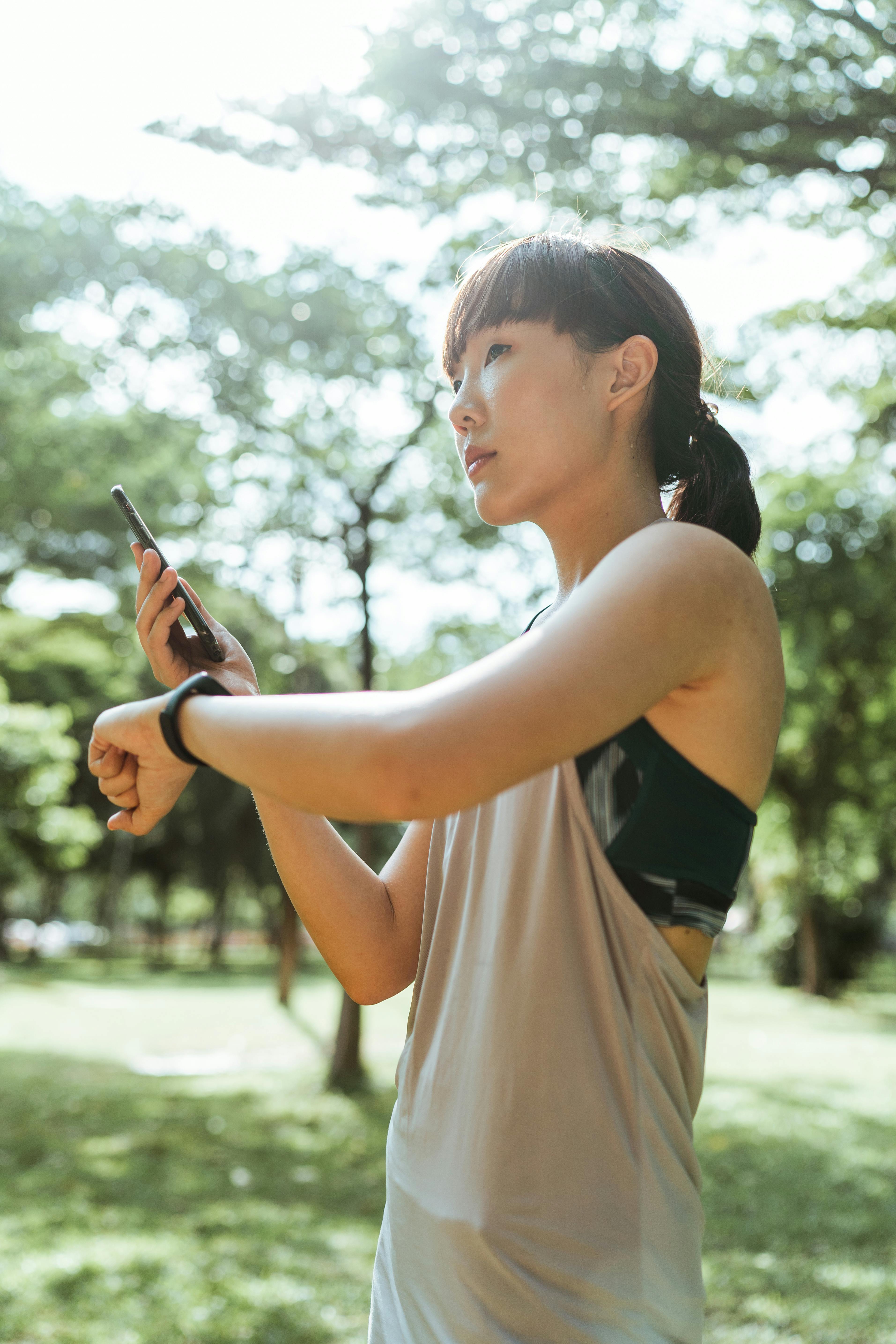 calm woman checking information about training on smartphone