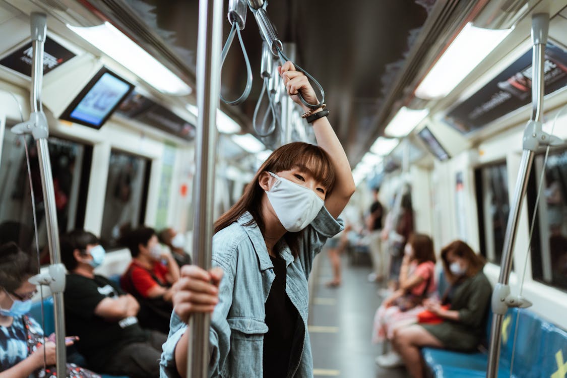 Free Woman Wearing a Face Mask on the Subway Stock Photo