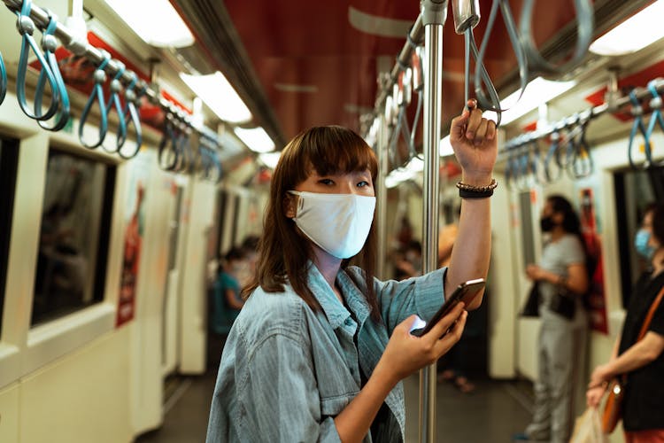 Woman Wearing A Face Mask On The Subway