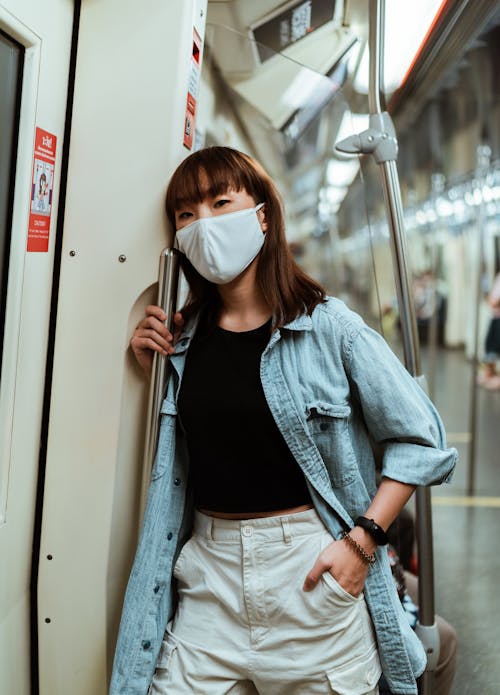 Free Woman Wearing a Face Mask on the Subway Stock Photo