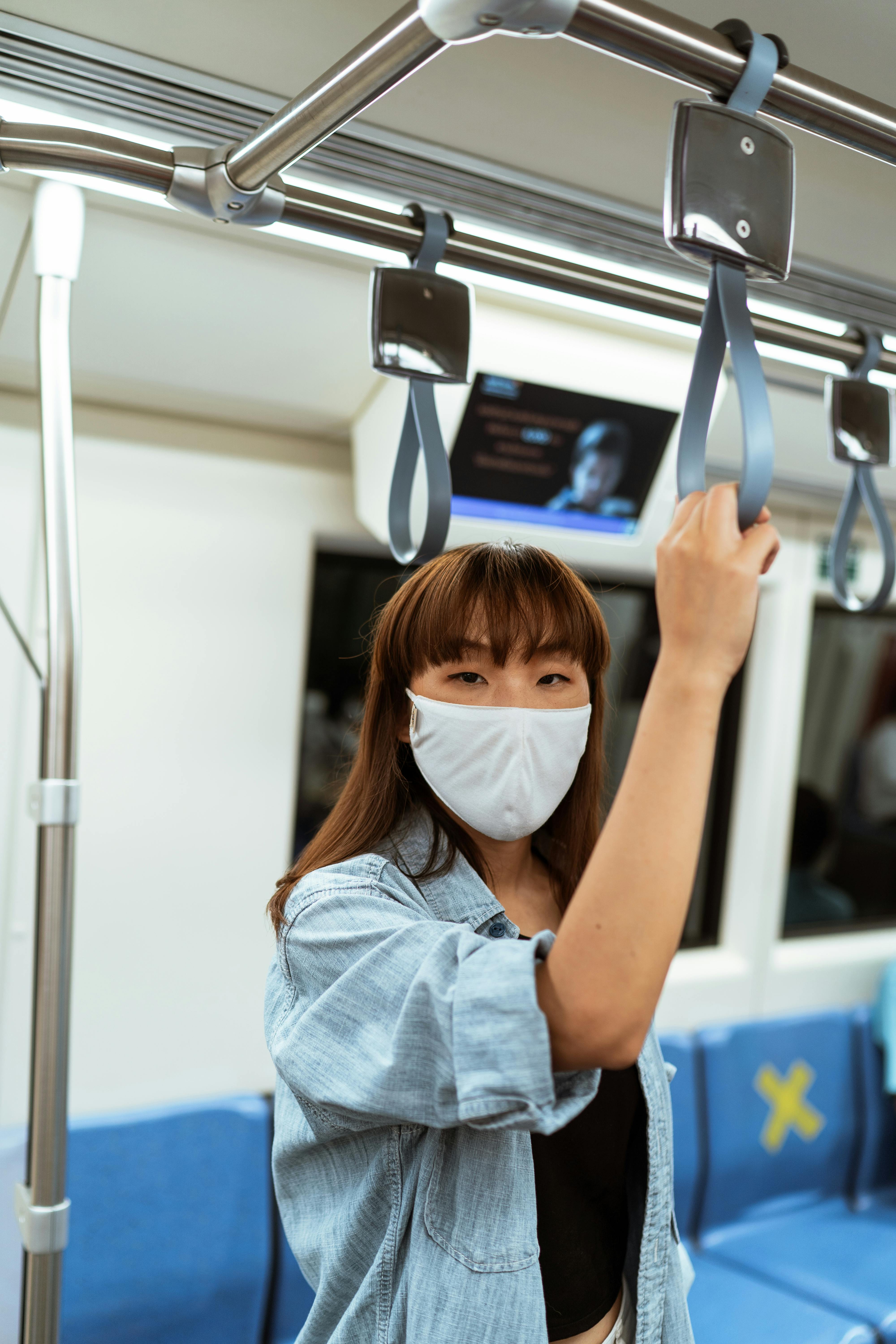 woman wearing a face mask on the subway