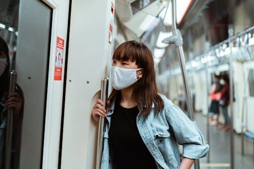 Free Woman Wearing a Face Mask on the Subway Stock Photo
