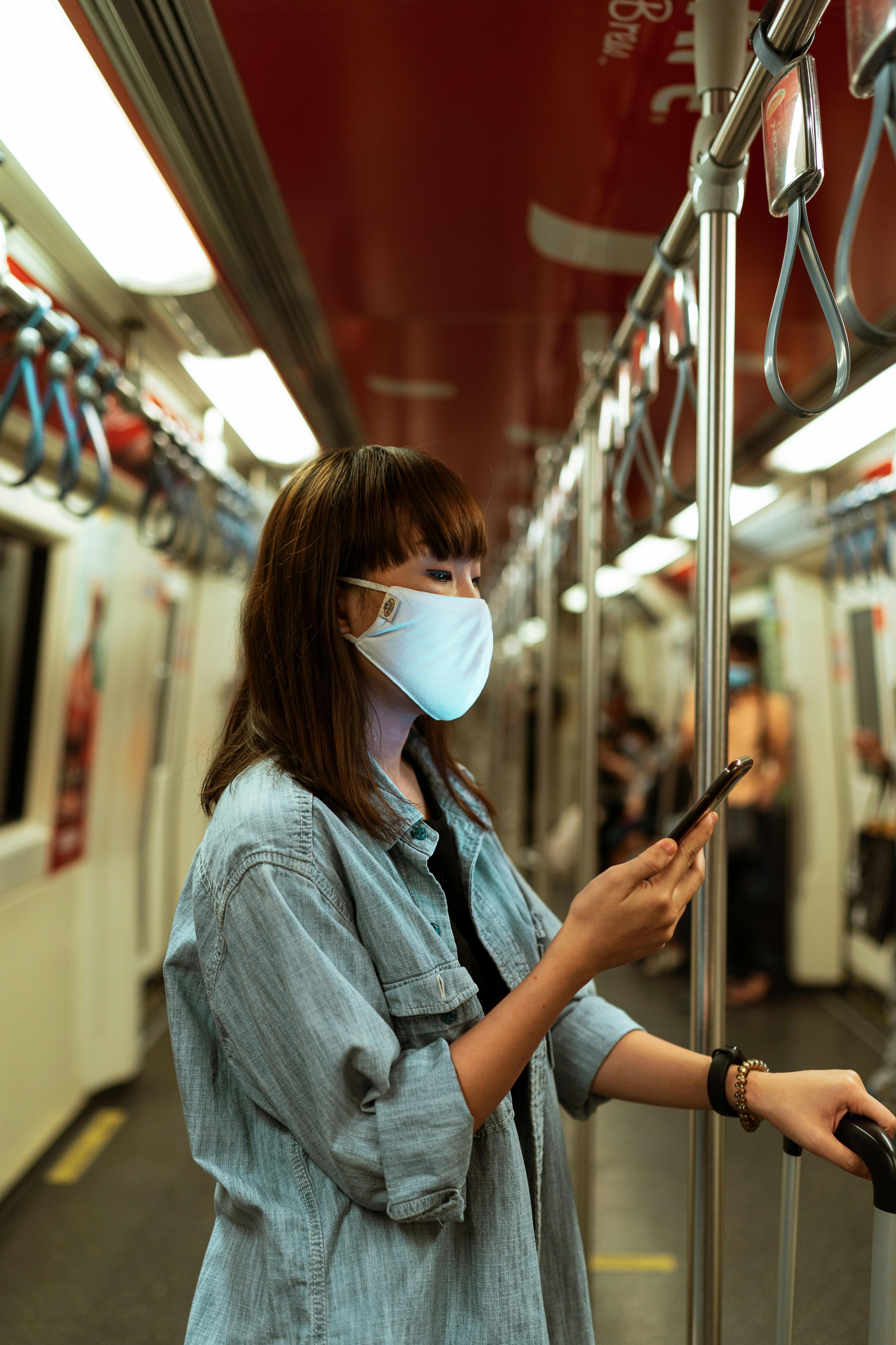 woman wearing a face mask on the subway