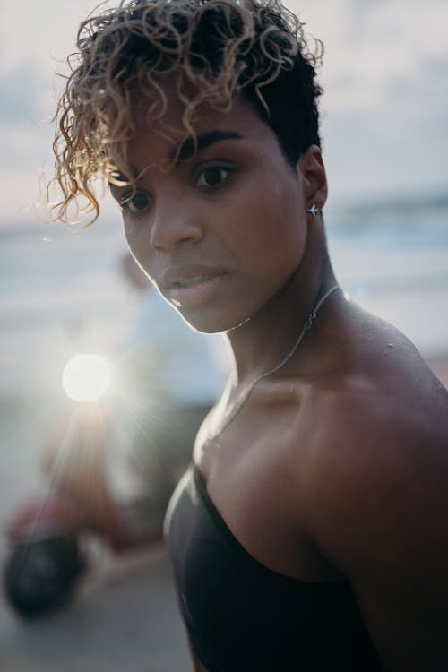 Woman in Black Brassiere Standing on Beach