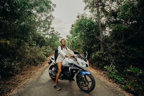 Man and Woman Riding on Motorcycle