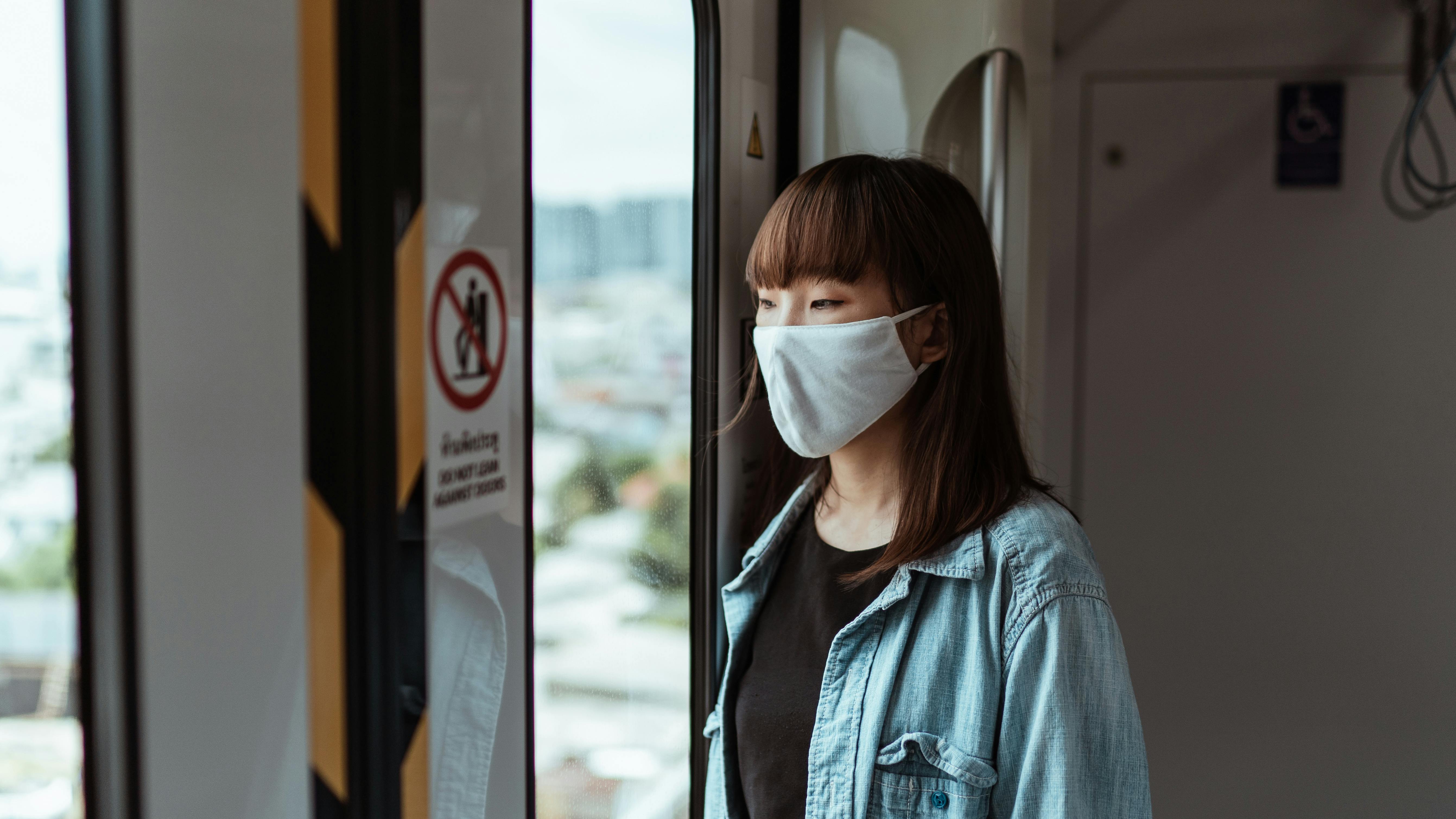 woman wearing a face mask on the subway