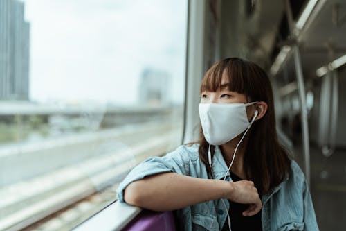 Woman Wearing a Face Mask on the Subway