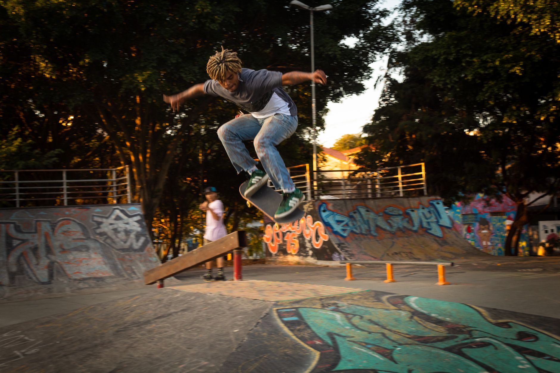 Skateboarder executing a trick at a vibrant São Paulo skate park, capturing urban youth culture.. pexels, skateboarder, execu