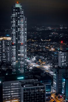 Stunning nighttime view of Incheon's modern skyscrapers with vibrant city lights.