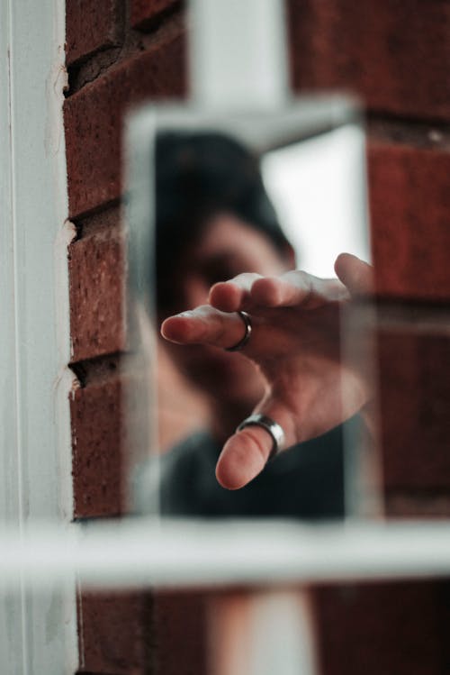 Reflection Photo of Person's Hand