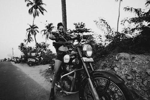 Grayscale Photo of Woman Riding Motorcycle