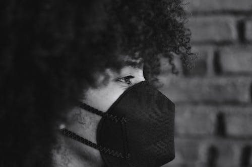 Free Grayscale Photo of Person Wearing Face Mask Stock Photo