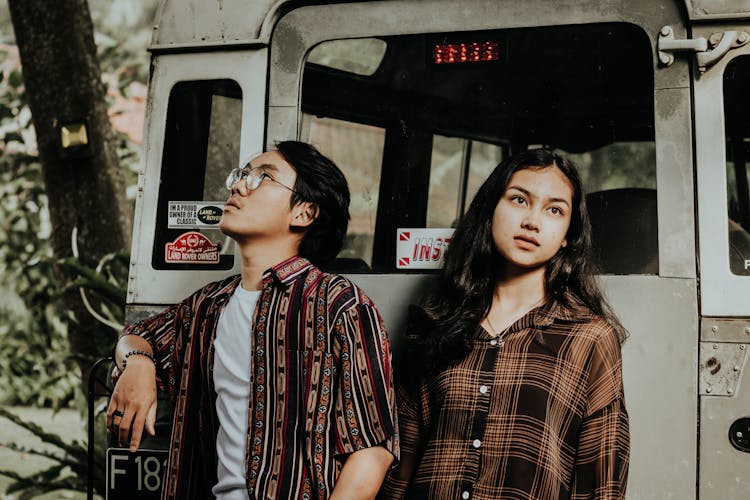 Couple Posing Against Retro Bus