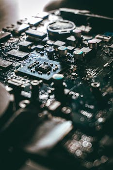 Detailed view of a computer motherboard with capacitors and chips.