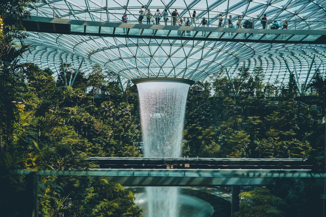 Free Fast waterfall in orangery in Singapore airport Stock Photo