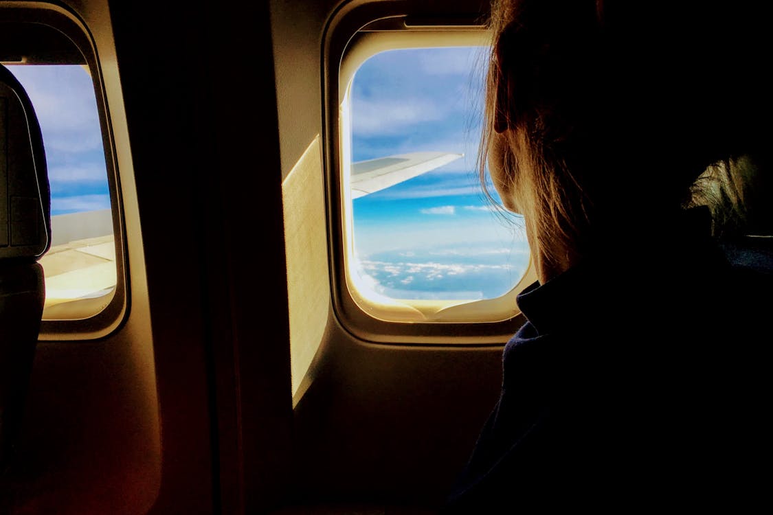 Free Person Riding on a Plane Stock Photo