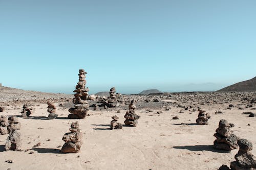 Free Stacks of Brown Rocks on Sand Stock Photo