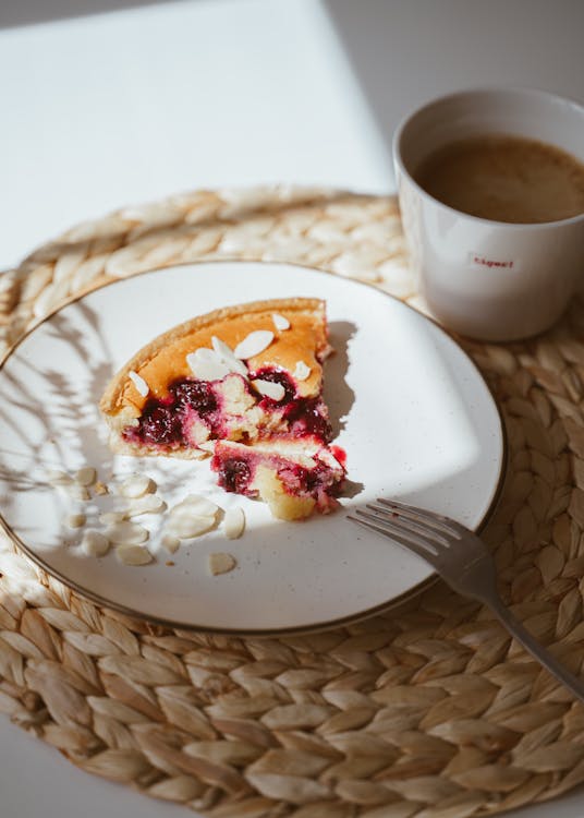 Free Delicious tart with cherries and almond petals for dessert Stock Photo