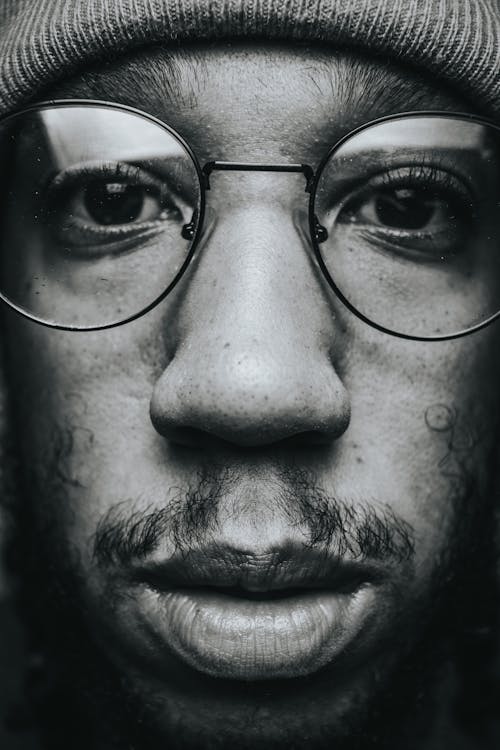 Thoughtful young black man in eyeglasses