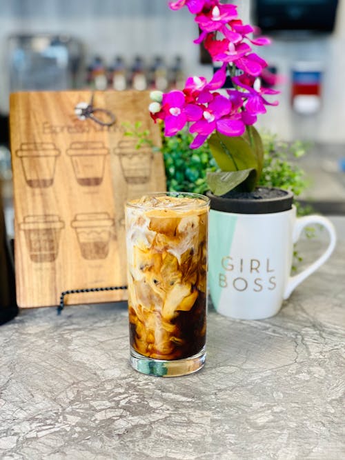 Mixing Milk and Coffee in Long Glass