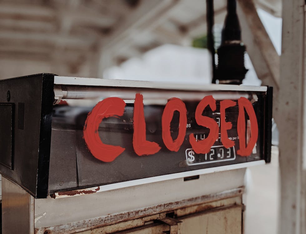 Free Closed Sign on a Gas Pump Stock Photo