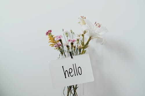 Free Bunch of Flowers with a Hello Sign Stock Photo
