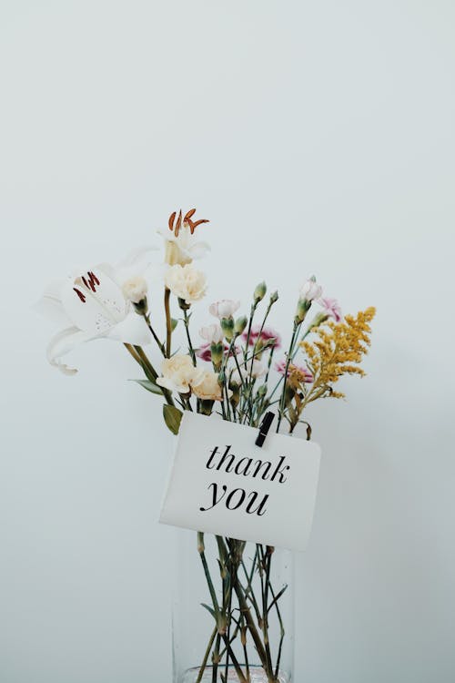 Free Bunch of Flowers with a Postcard Stock Photo