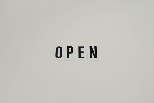 Simple and minimalist text reading 'OPEN' on a white background, ideal for business use.