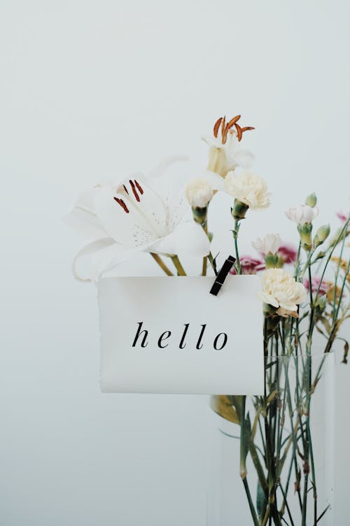 Bunch of Flowers on a Vase with a Note